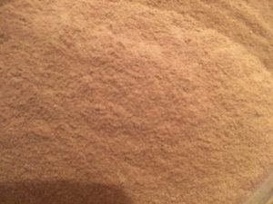 Close-up of finely ground brown cob powder for baking or cooking.