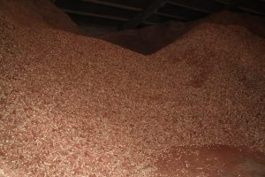 Close-up of a large pile of red and white gravel for construction use.