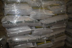 Stacked bags of premium animal bedding at Best Cob store.