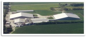 Aerial view of Best Cob facility surrounded by green fields and farmland.