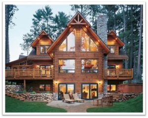 Luxury wooden cabin in forest with large windows and outdoor deck.