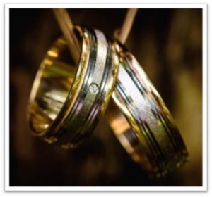 Close-up of wedding rings with a blurred background.