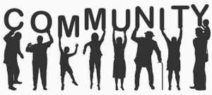 Diverse group of people holding up the word 'Community' in black and white.