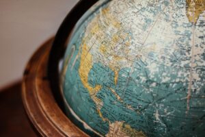 Close-up of a vintage globe showing North America and Asia.