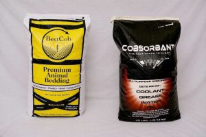 Two bags of Best Cob products: animal bedding and coolant for automotive use.