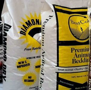 Close-up of Best Cob animal bedding bag with yellow and black design.
